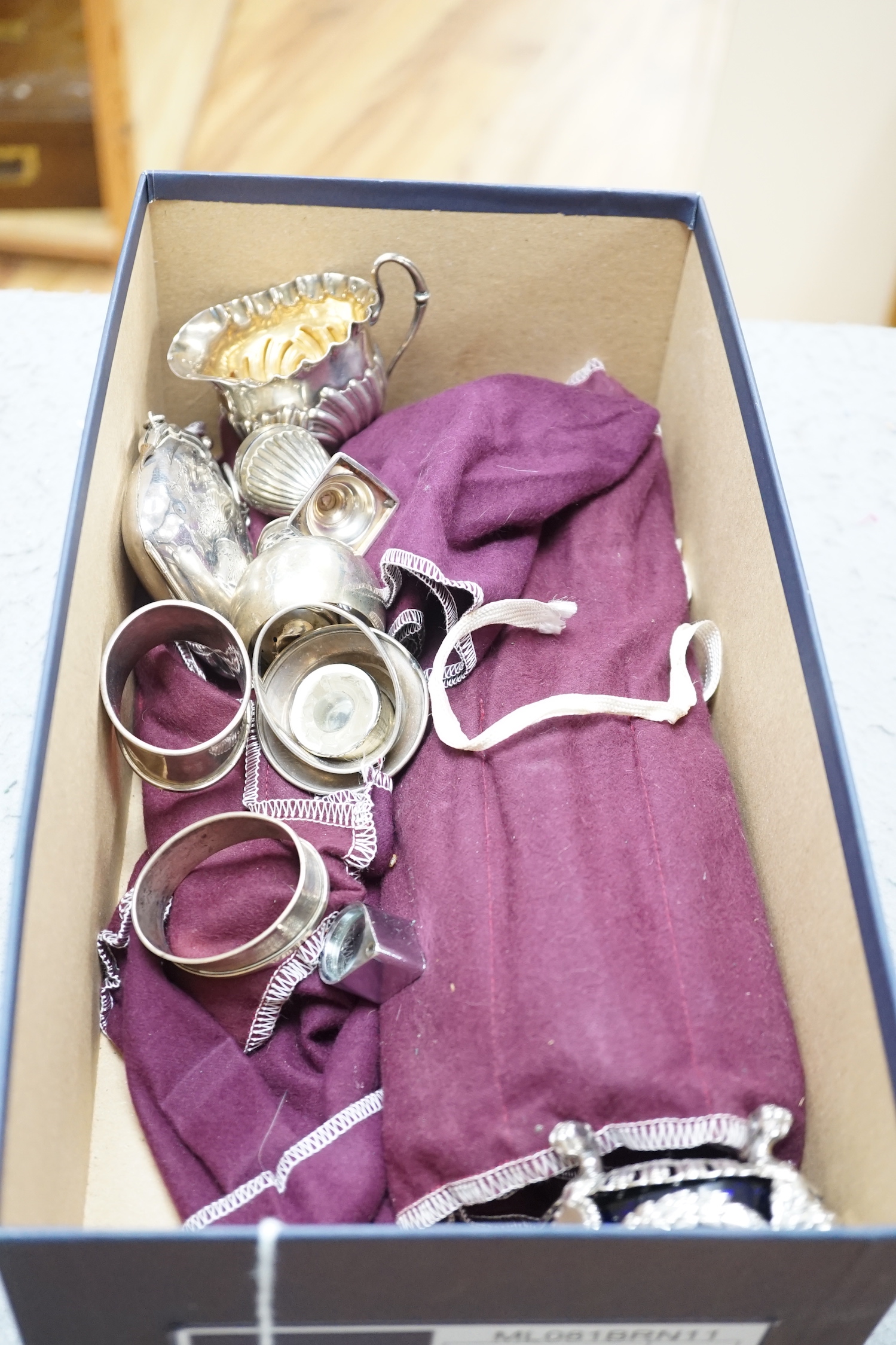 Sundry small silver wares including a pair of modern wine coasters, purse, mug, jug, napkin rings, etc, three plated salts and twelve sterling handled table knives and twelve dessert knives.